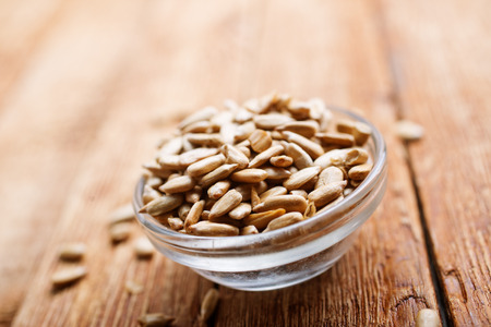 sunflower seed in bowl on a tableの写真素材