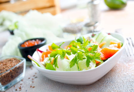 Fresh green  salad with smoked salmon and cherry tomatoesの写真素材