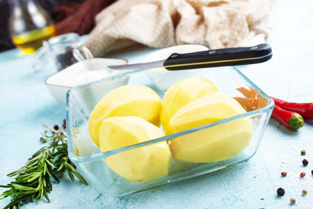 Raw potato prepare for cooking, Fresh organic golden potatoes.の写真素材