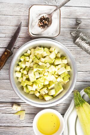 green zucchini on dark background. Healthy food, green vegan diet.の写真素材
