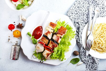 kebab with meat and vegetables on plateの写真素材