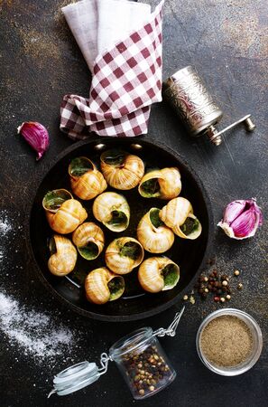 Snails baked with sauce, Baked snails with butter and spiceの写真素材
