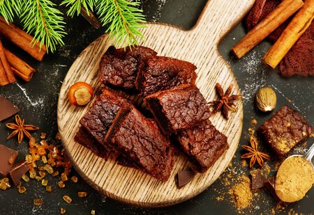 chocolate cake on wooden board and on a tableの写真素材