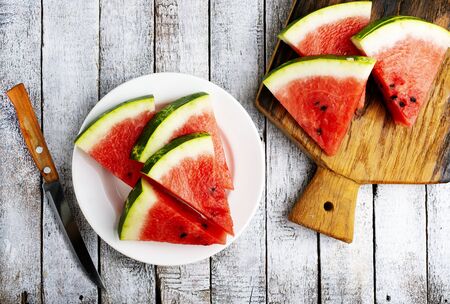 Pieces of juicy, ripe watermelon on white plateの写真素材