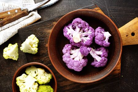 raw cauliflower in bowl, color cauliflower in brown bowlの写真素材
