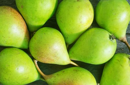 green pears, fresh pears on the wooden tableの写真素材