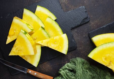 fresh watermelon on board on a tableの写真素材