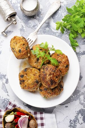 fresh cutlets on plate on a tableの写真素材