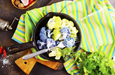 Coloured cauliflowers served on pan.  Purple, white, yellow and cauliflower green. の写真素材