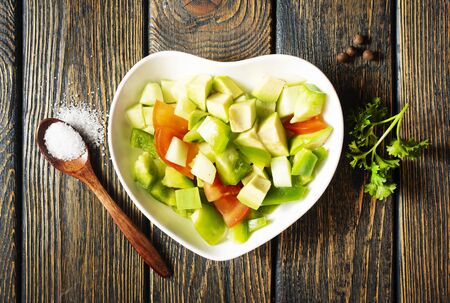 fresh salad, salad with avocado and pepperの写真素材