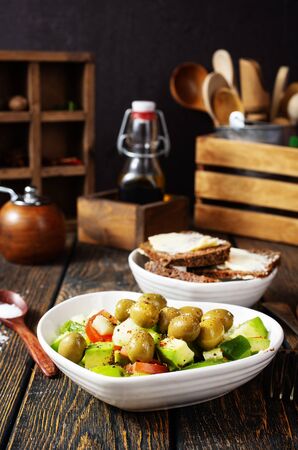 diet food, fresh salad with vegetables and oilの写真素材