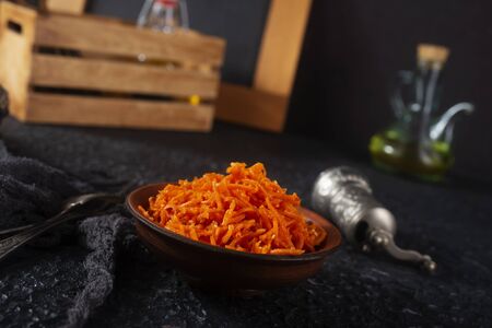 raw carrot, diet food, fresh carrot with coconut oil in bowlの写真素材