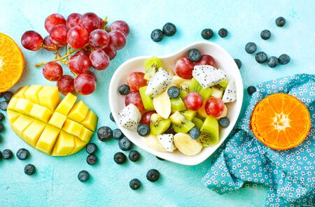 fruit salad, fresh salad with fruits and berriesの写真素材