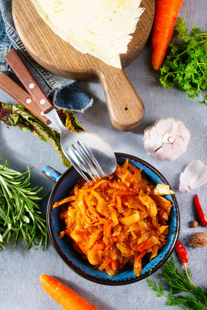 fried cabbage with tomato sauce and vegetables