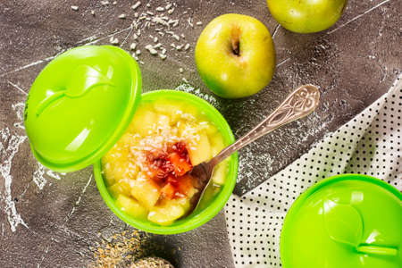 Rice porridge with cinnamon and green applesの写真素材