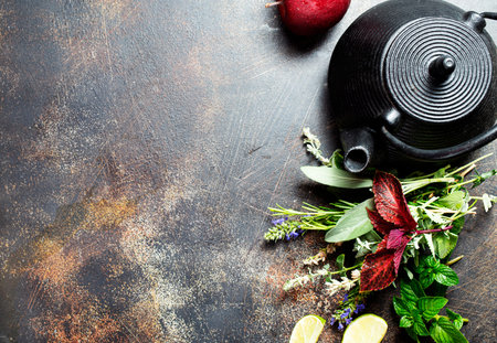 teapot with aroma herb for tea on a tableの写真素材