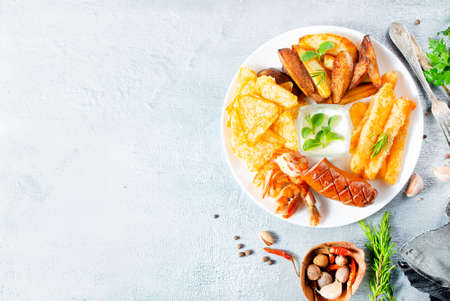 fried potato sausage shrimp and cheese sticksの写真素材
