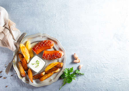 fried sausage potato fish fillet and nachosの写真素材