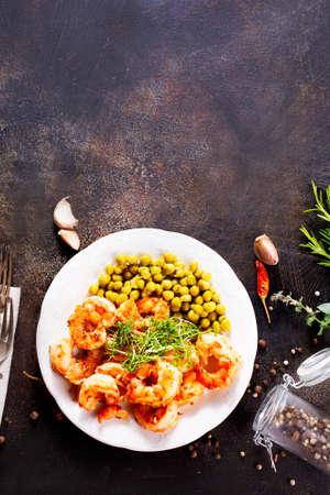 fried shrimps with boiled corn, salad with shrimpsの写真素材