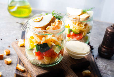 caesar salad in glass bank, fresh salad with chickenの写真素材