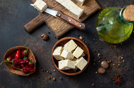 Fresh tofu on board, an alternative to meat protein. Vegetarian cuisine.の写真素材