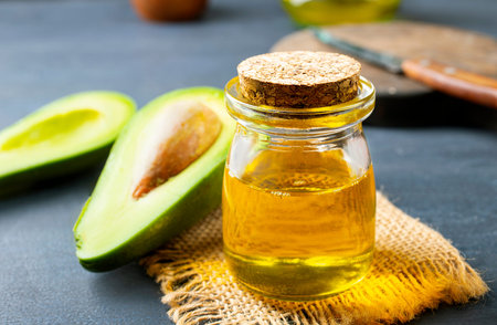 fresh avokado, green avocado and oil in bottleの写真素材