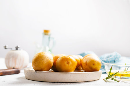 raw potatoes on a tableの写真素材