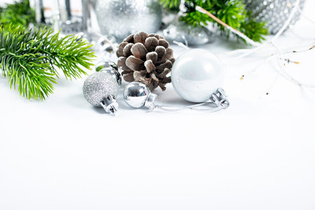 Beautiful christmas baubles hanging from graaen branchesの写真素材