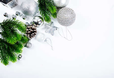 Beautiful christmas baubles hanging from graaen branchesの写真素材