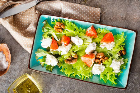 Camamber, beet salad and bread on blue plateの写真素材