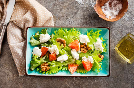 Fresh summer salad with shrimp, avocado and tomato in bowl on light table. concept of healthy eating.の写真素材