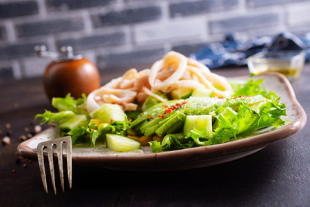 Fresh salad of autumn vegetables - purple and green cabbage, carrots, green onions. salad in bankの写真素材