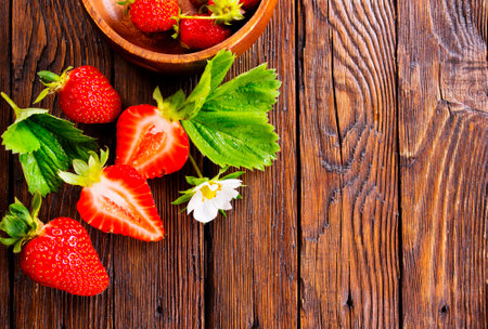 Fresh ripe organic strawberry on wooden tableの写真素材