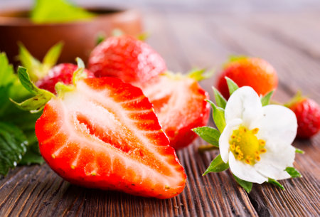 Fresh ripe organic strawberry on wooden tableの写真素材