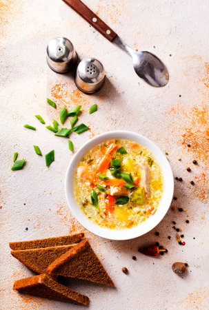 Pea soup with pieces of bacon and parsley in a bowlの写真素材