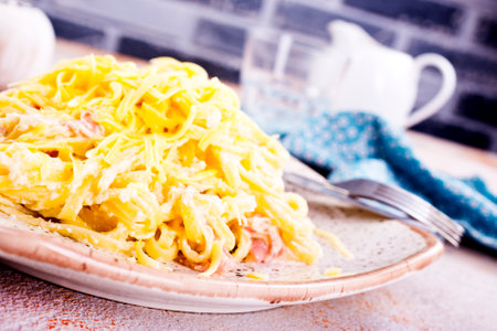 Pasta Carbonara with bacon and parmesan on plate.の写真素材