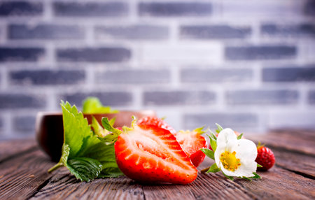 Fresh ripe organic strawberry on wooden tableの写真素材
