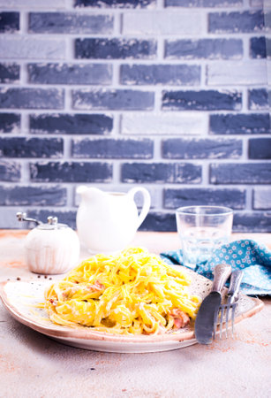 Pasta Carbonara with bacon and parmesan on plate.の写真素材
