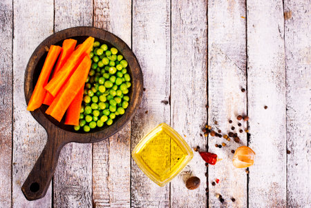 Organic Fresh Green Pea and Carrot Salad Pattern Backgroundの写真素材