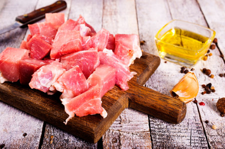 Raw beef fillet steaks with herbs and spices on wooden backgroundの写真素材
