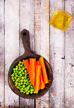Organic Fresh Green Pea and Carrot Salad Pattern Backgroundの写真素材