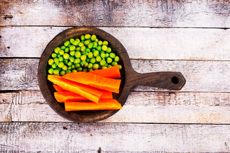 Organic Fresh Green Pea and Carrot Salad Pattern Backgroundの写真素材