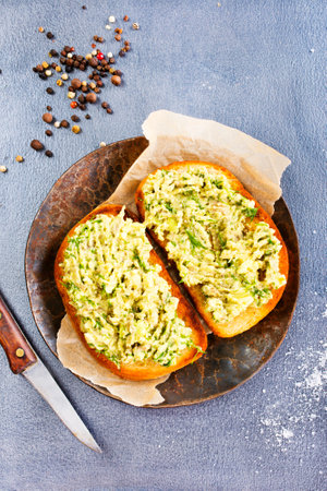 Healthy avocado toasts for breakfast or lunch with rye bread/Vegetarian sandwiches. Plant-based diet. Whole food concept.の写真素材