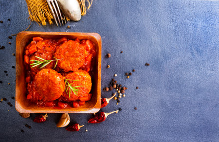 hot meatballs with tomato sauce and basil close-up. top viewの写真素材
