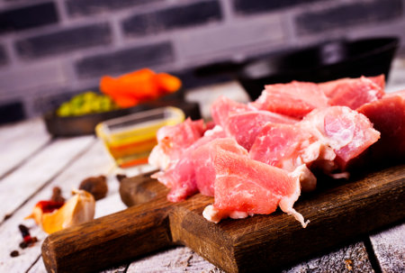 Raw beef fillet steaks with herbs and spices on wooden backgroundの写真素材
