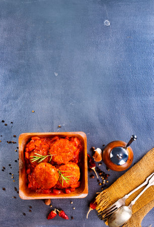 hot meatballs with tomato sauce and basil close-up. top viewの写真素材