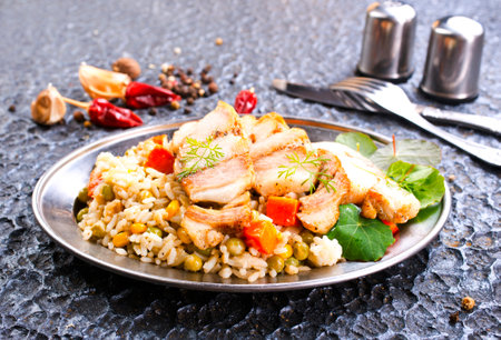Meat fried with vegetables, a side dish of bulgur, top viewの写真素材