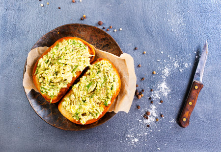 Healthy avocado toasts for breakfast or lunch with rye bread/Vegetarian sandwiches. Plant-based diet. Whole food concept.の写真素材