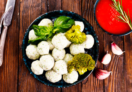 Meat balls with broccoli on plate.の写真素材