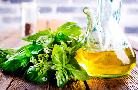 Organic sunflower oil with fresh basilの写真素材